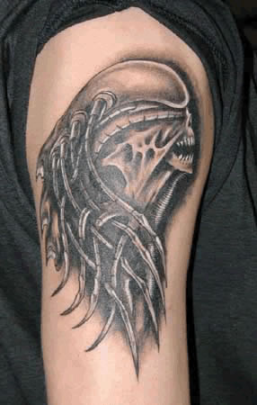 Alien arm tattoo