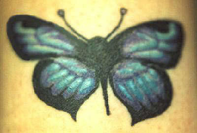 Turquoise-colored butterfly tattoo